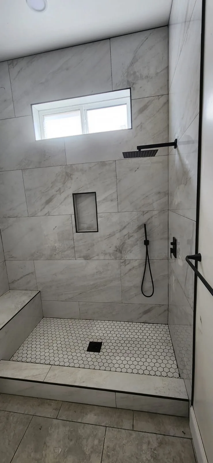 Bathroom faucet and sink installation — polished chrome fixtures, white porcelain sink, clean tile backsplash, bright bathroom